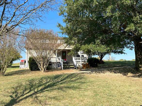 6.4 Acres of Land with Home for Sale in Martin, Tennessee