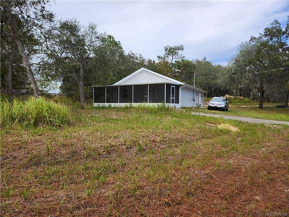 1.5 Acres of Residential Land with Home for Sale in Homosassa, Florida