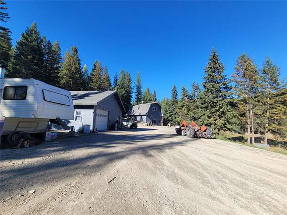 18.1 Acres of Recreational Land with Home for Sale in Kila, Montana