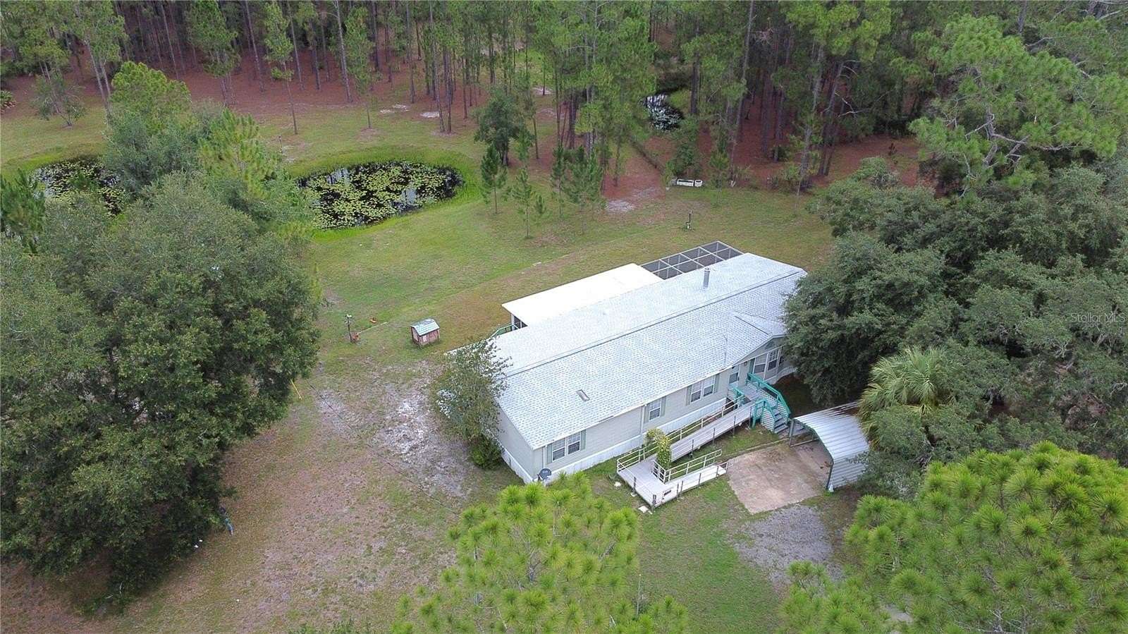 7.2 Acres of Residential Land with Home for Sale in Citra, Florida