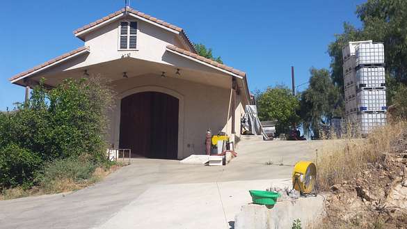 Back of Winery building with 13 foot entry door