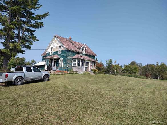 120 Acres of Land with Home for Sale in Rock, Michigan