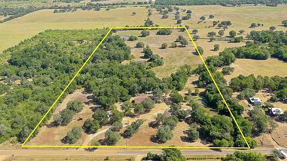 26.645 Acres of Agricultural Land with Home for Sale in Paige, Texas