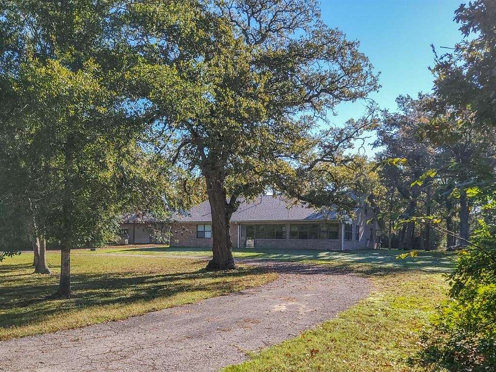 5.2 Acres of Residential Land with Home for Sale in Huntsville, Texas