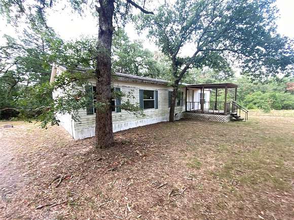 2 Acres of Residential Land with Home for Sale in Jewett, Texas
