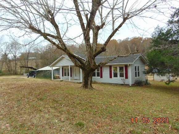 7.1 Acres of Residential Land with Home for Sale in Decaturville, Tennessee