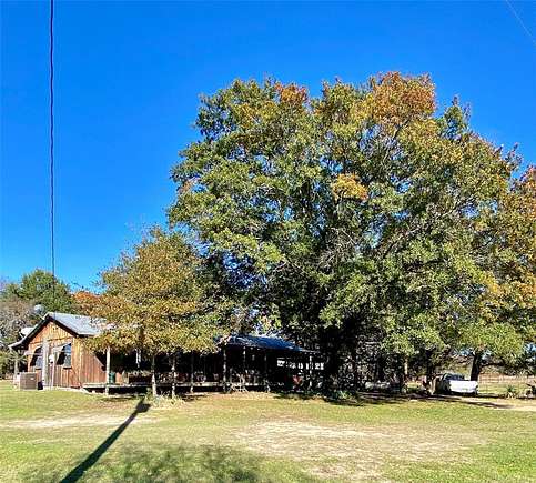 34.8 Acres of Agricultural Land with Home for Sale in Ravenna, Texas