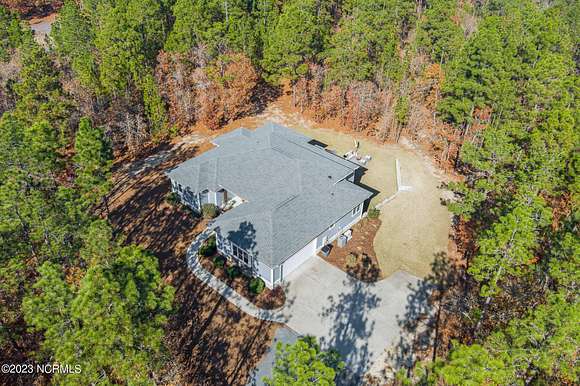 6.2 Acres of Residential Land with Home for Sale in West End, North Carolina