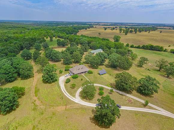 218 Acres of Land with Home for Sale in Dadeville, Missouri
