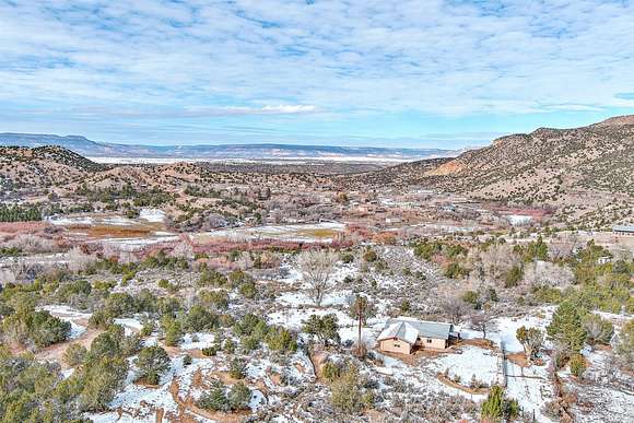 2.5 Acres of Residential Land with Home for Sale in Cañones, New Mexico