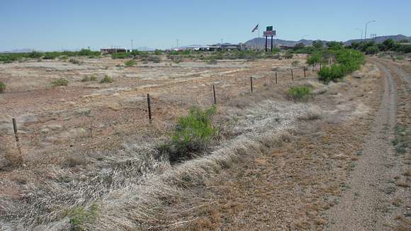 A view of the frontage road and acreage.