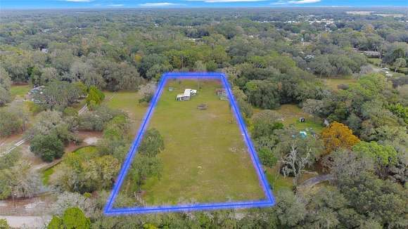 2.4 Acres of Residential Land with Home for Sale in Wesley Chapel, Florida