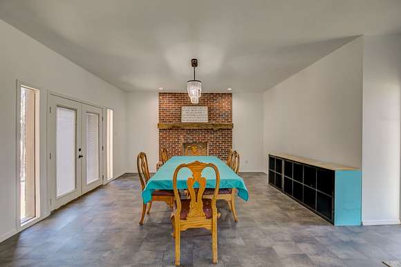 Formal dining room with fireplace.
