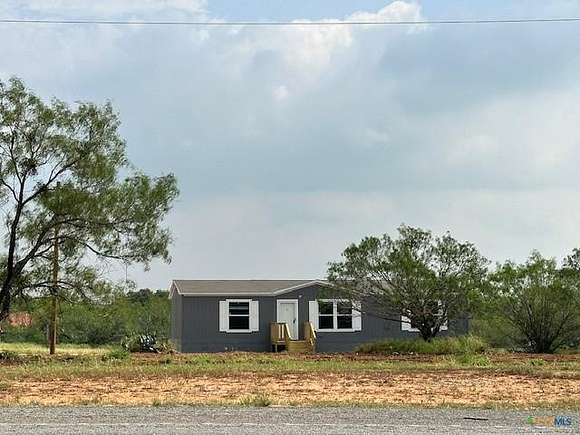 2.9 Acres of Residential Land with Home for Sale in Poteet, Texas