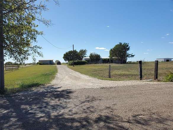 13.34 Acres of Land with Home for Sale in Grandview, Texas