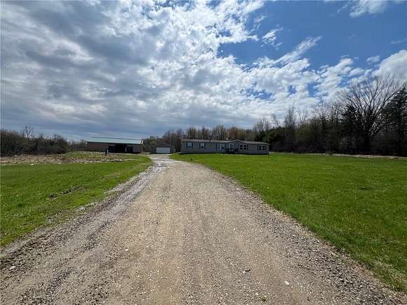 55.7 Acres of Land with Home for Sale in Waterford, Pennsylvania