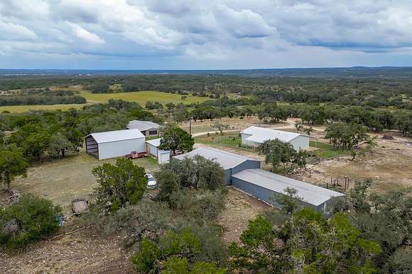 102.9 Acres of Agricultural Land with Home for Sale in Dripping Springs, Texas