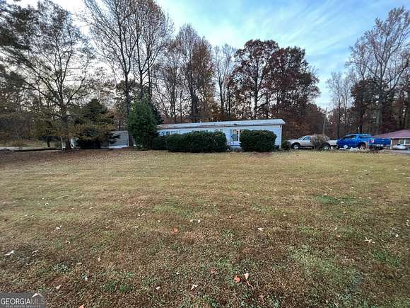 3.3 Acres of Residential Land with Home for Sale in Cumming, Georgia