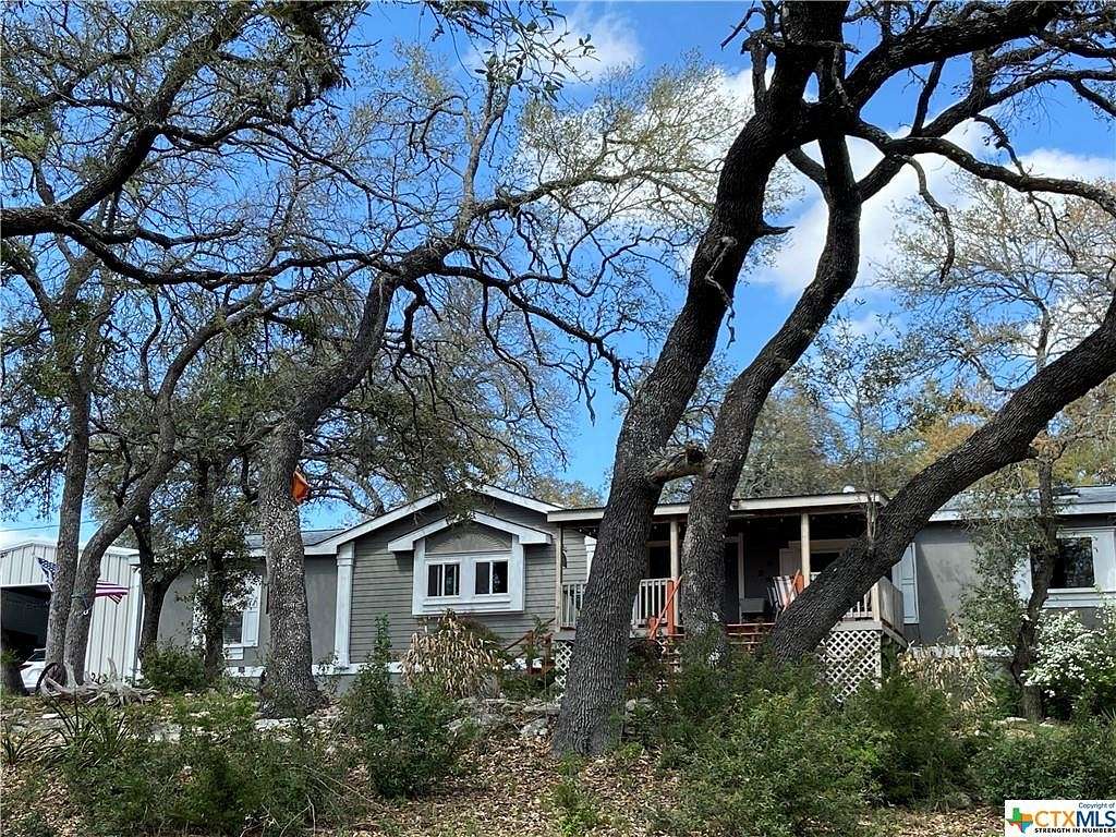 6.4 Acres of Residential Land with Home for Sale in Canyon Lake, Texas