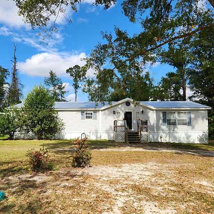 2.7 Acres of Residential Land with Home for Sale in Wewahitchka, Florida