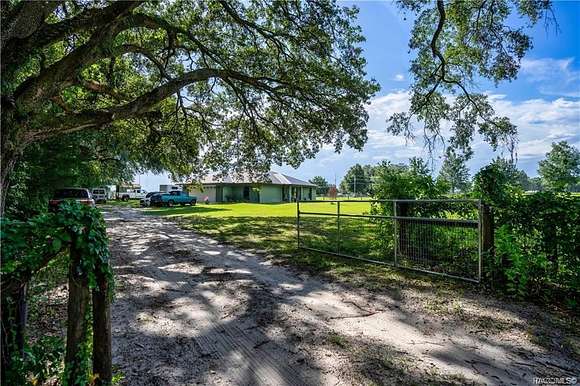 9.8 Acres of Residential Land with Home for Sale in Oxford, Florida