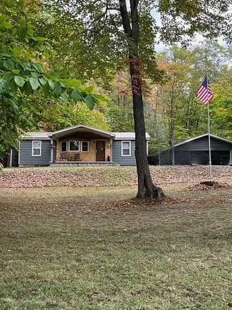 2.5 Acres of Residential Land with Home for Sale in Chase, Michigan