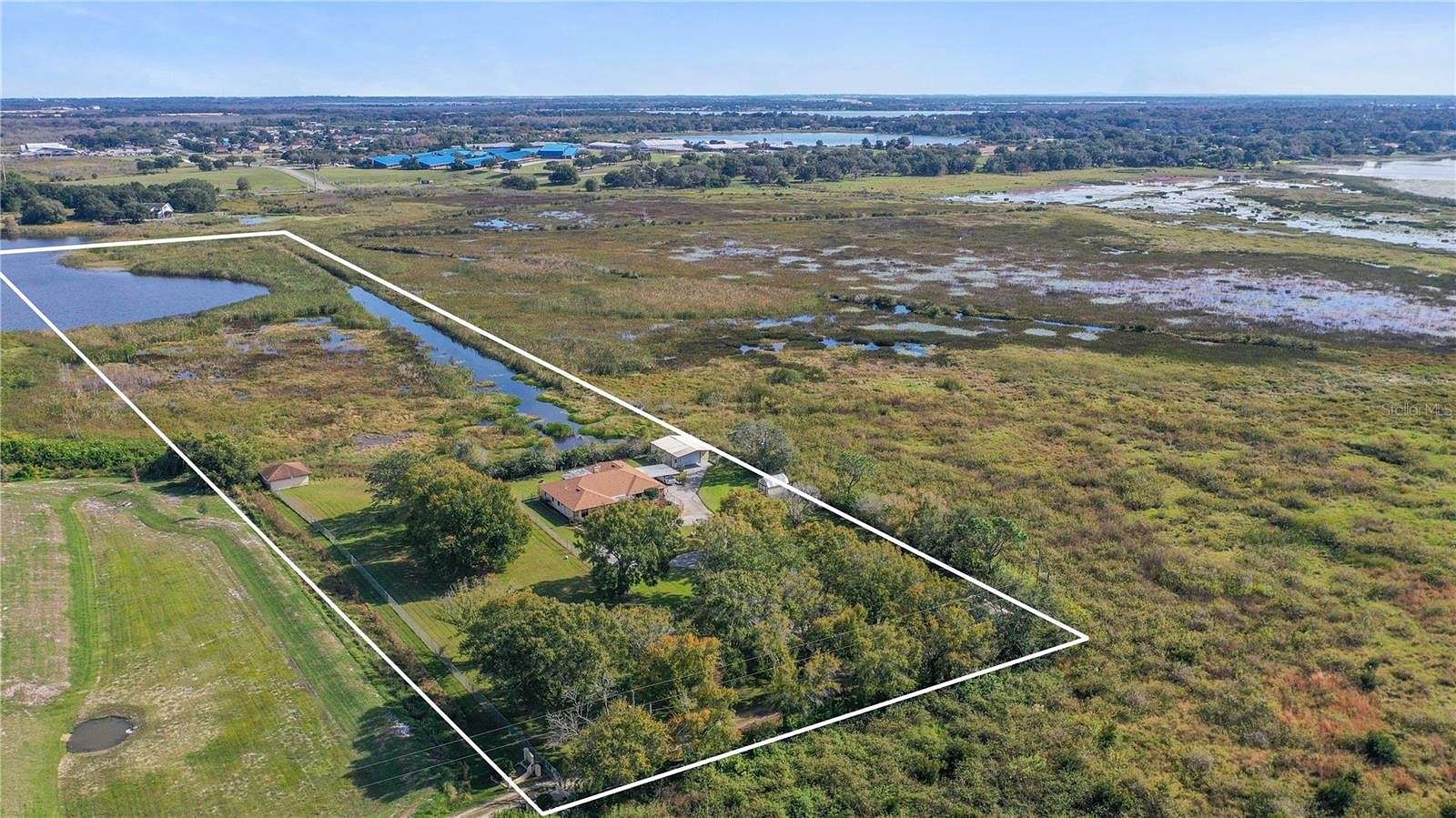 11.9 Acres of Recreational Land with Home for Sale in Lake Alfred, Florida