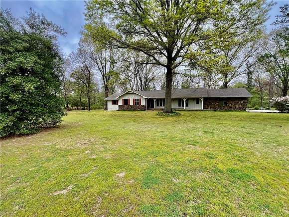 7.7 Acres of Residential Land with Home for Sale in Little Flock, Arkansas