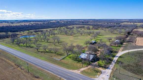 69.9 Acres of Agricultural Land with Home for Sale in De Leon, Texas
