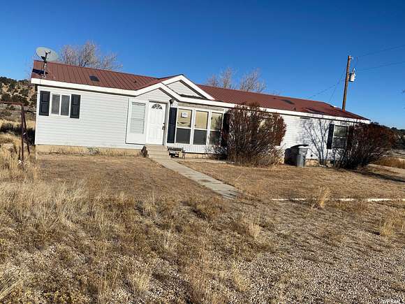 5 Acres of Residential Land with Home for Sale in Fruitland, Utah