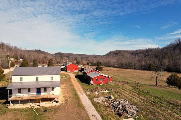 26.4 Acres of Land with Home for Sale in Liberty, Kentucky