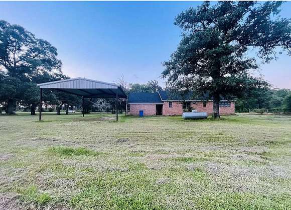 3 Acres of Residential Land with Home for Lease in Groveton, Texas
