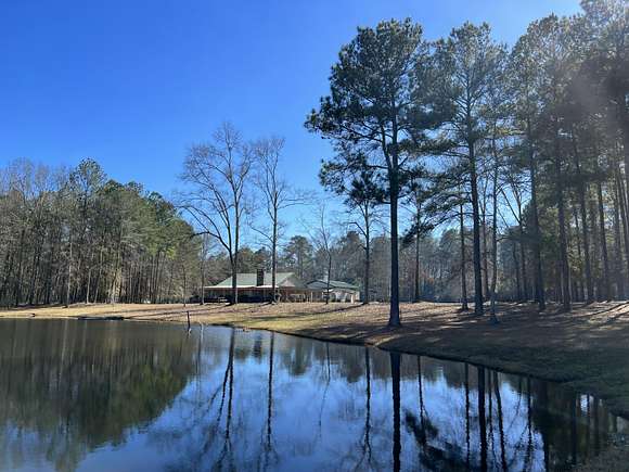 14.3 Acres of Land with Home for Sale in Collins, Mississippi