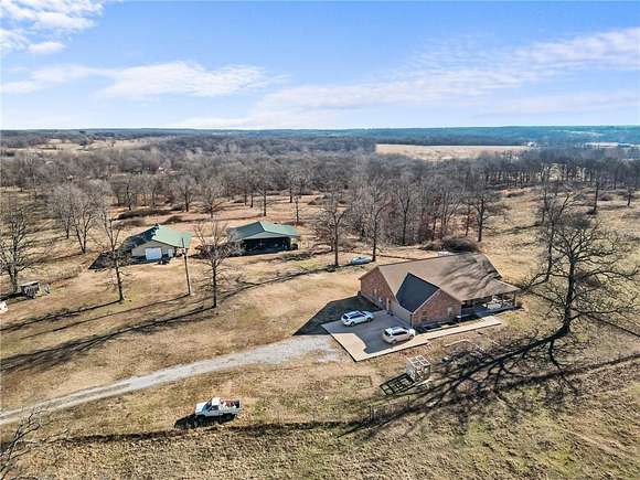 140 Acres of Agricultural Land with Home for Sale in Gentry, Arkansas
