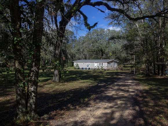 4.4 Acres of Residential Land with Home for Sale in Reddick, Florida