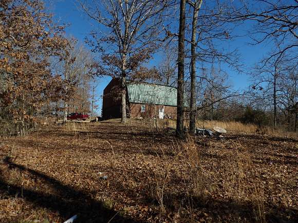 49 Acres of Recreational Land with Home for Sale in Caulfield, Missouri