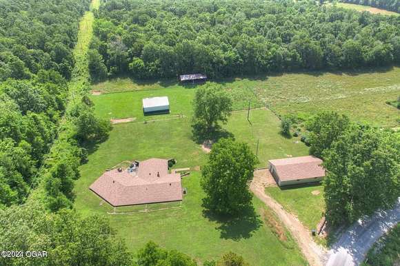 25.7 Acres of Land with Home for Sale in Neosho, Missouri