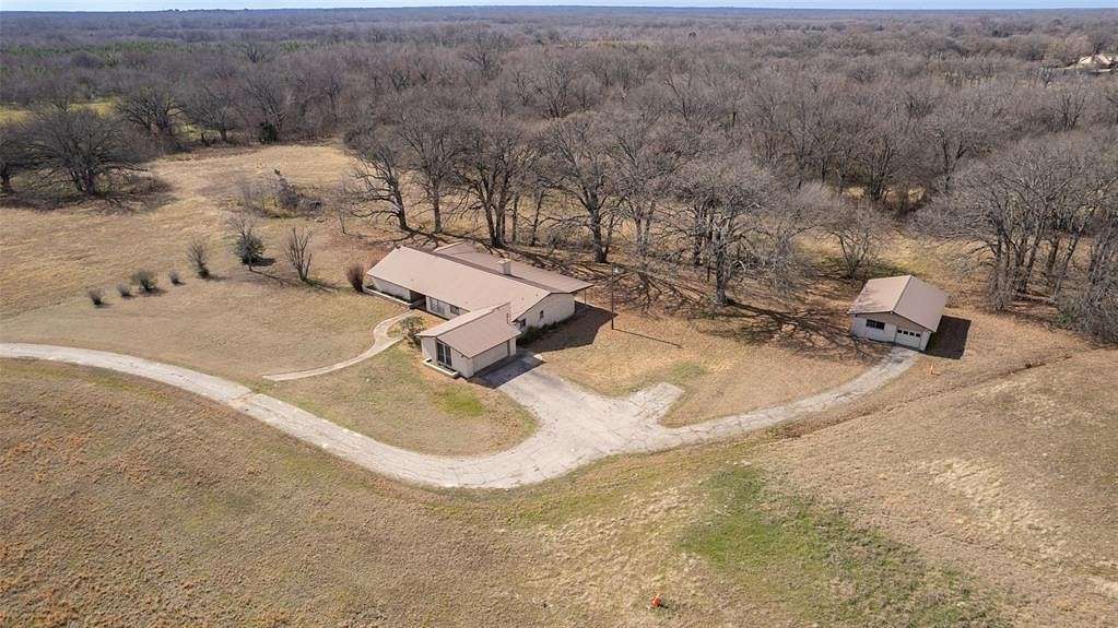 22.9 Acres of Agricultural Land with Home for Sale in Commerce, Texas