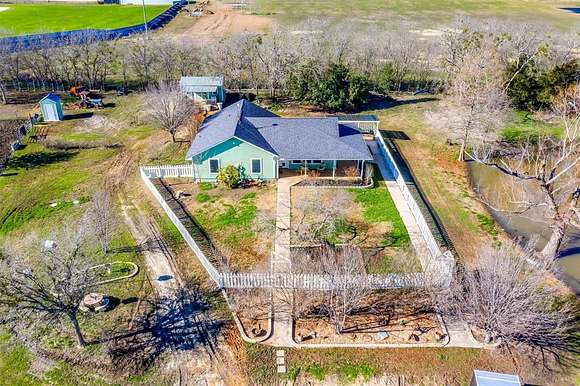 11.1 Acres of Land with Home for Sale in Grandview, Texas