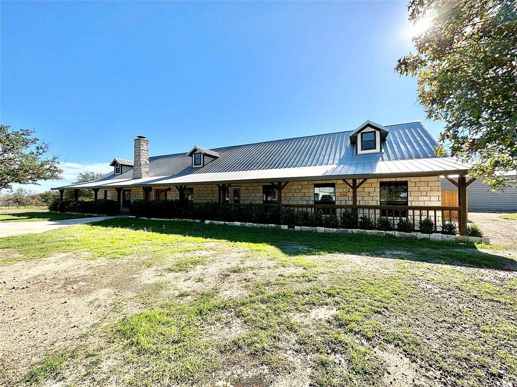 230 Acres of Agricultural Land with Home for Sale in Hico, Texas