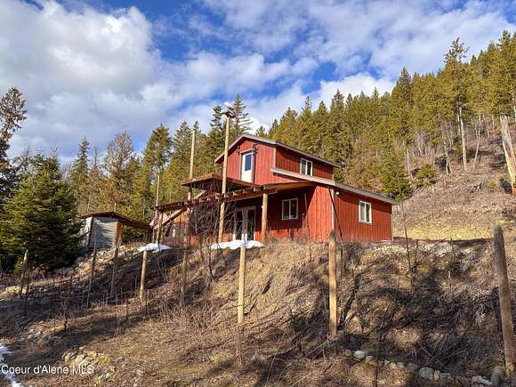16.9 Acres of Land with Home for Sale in Moyie Springs, Idaho