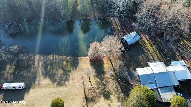83.5 Acres of Agricultural Land with Home for Sale in Friendsville, Tennessee