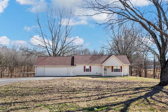 5.7 Acres of Residential Land with Home for Sale in Covington, Tennessee