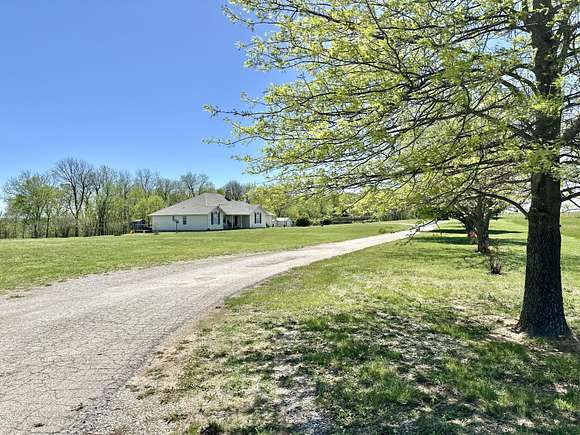 10 Acres of Residential Land with Home for Sale in Walnut Grove, Missouri