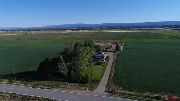 230 Acres of Agricultural Land with Home for Sale in Redvale, Colorado