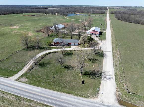 91.8 Acres of Agricultural Land with Home for Sale in Windsor, Missouri