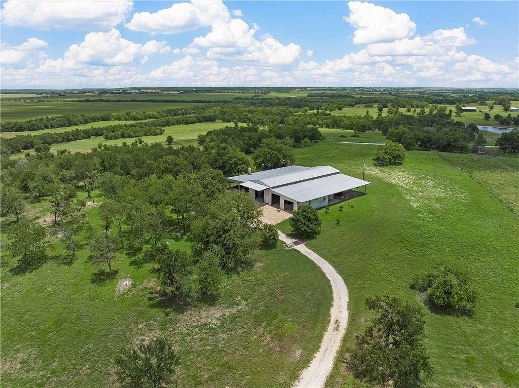 21.06 Acres of Agricultural Land with Home for Sale in Lott, Texas