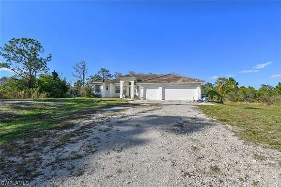 2.5 Acres of Residential Land with Home for Auction in Naples, Florida