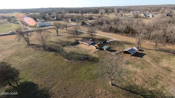 76.8 Acres of Land with Home for Sale in Neosho, Missouri