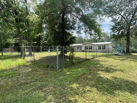 2.4 Acres of Residential Land with Home for Sale in Wewahitchka, Florida
